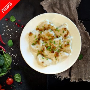 Pierogi  ruskie ,śmietana ,cebula 
